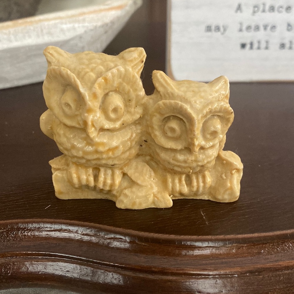 2 hand carved owls sitting made out of stone